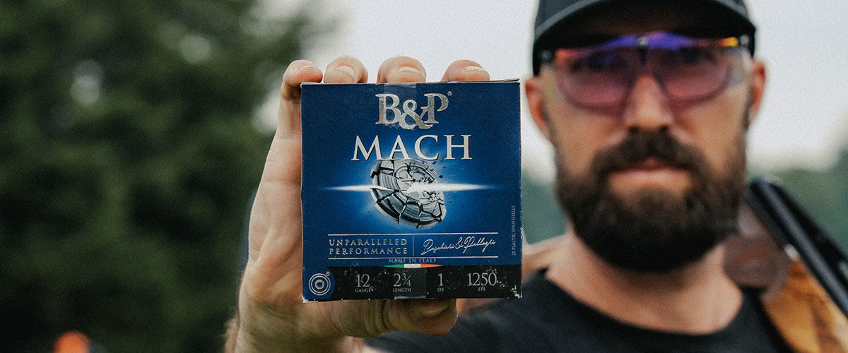 shooter holding a Mach box