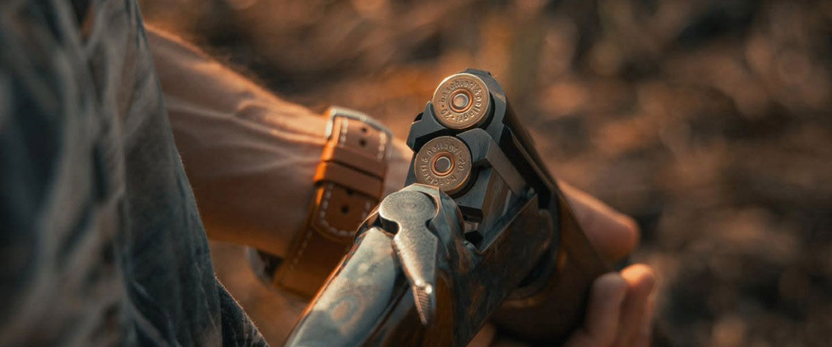person holding a shotgun