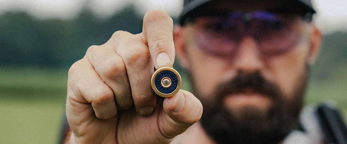 shooter holding a Mach shotshell