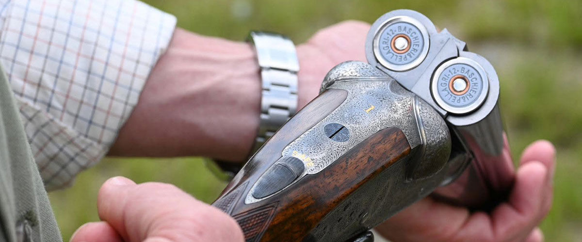 person holding a shotgun