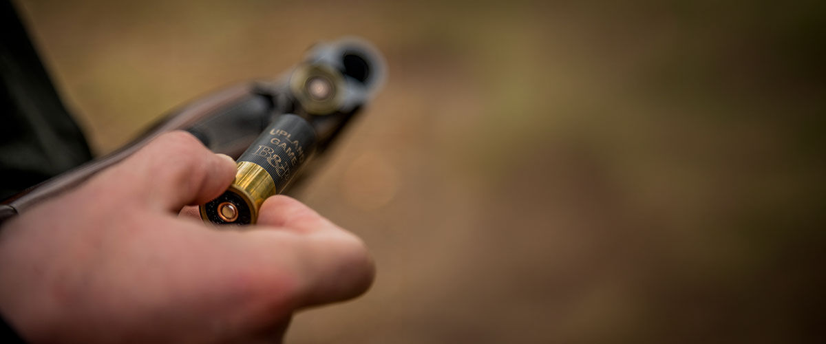 shooter loading shotgun