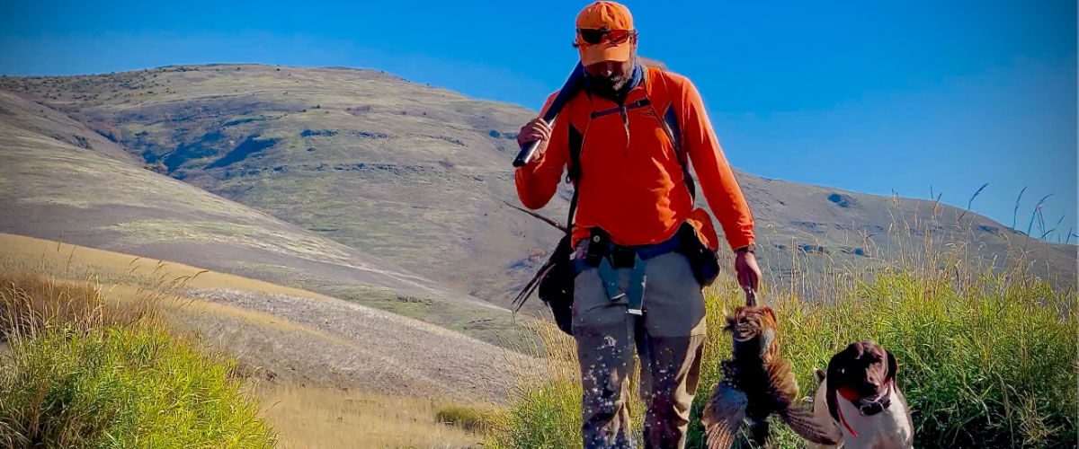hunter walking with a dog